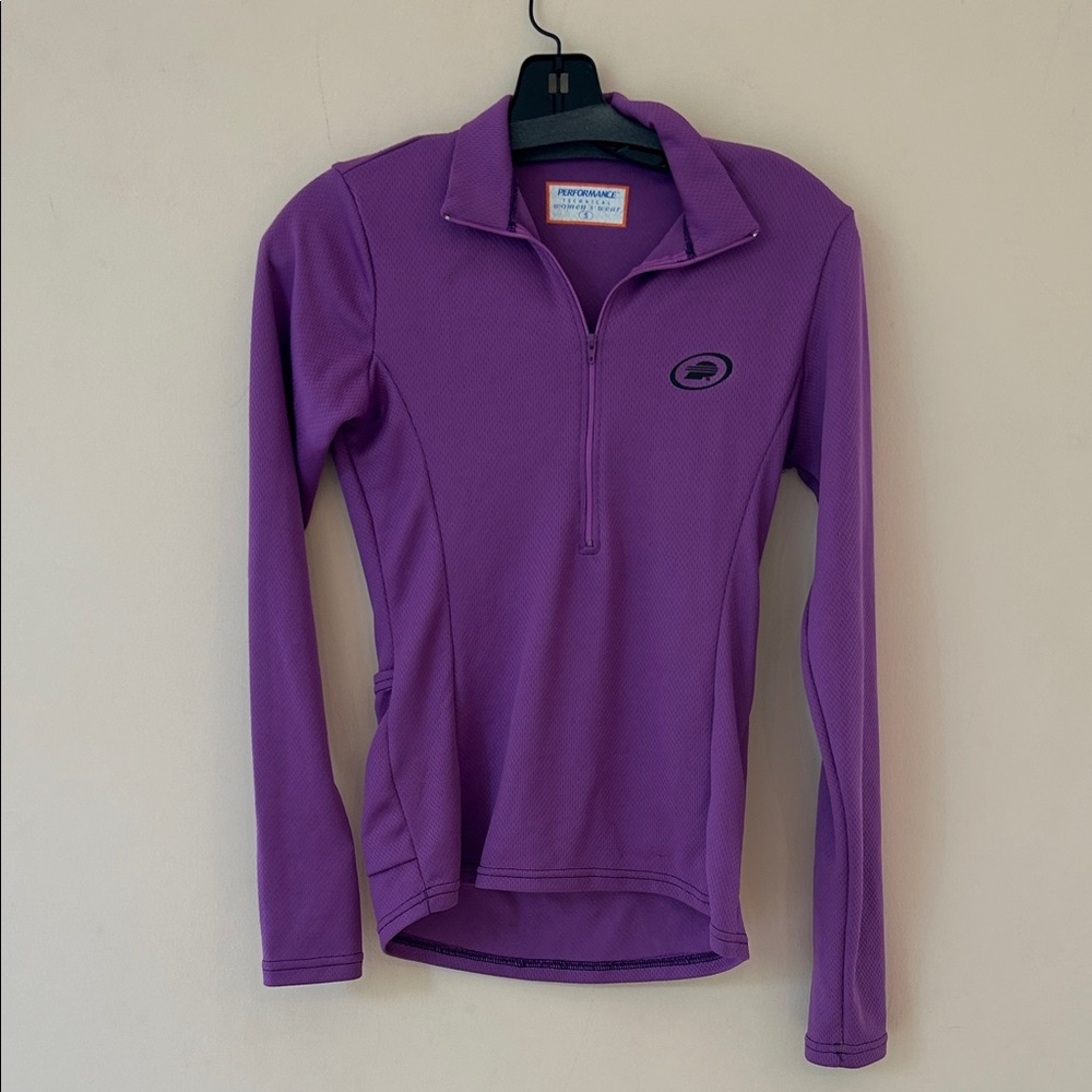 Bicycle top. Long sleeves. Zipper at neck in front. 3 back pockets